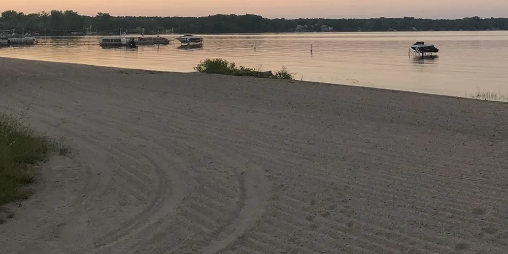 The community beach and boats at dusk